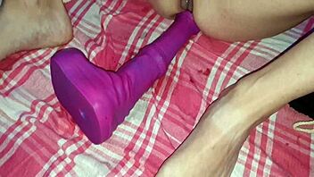 Anal training with huge dildo in chastity?