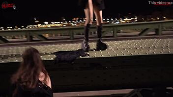 Risky lesbian sex in public on a bridge between passersby.