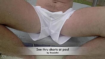 Pool boy Xnxxjohn shows off in see-through outfit. Underwater, his big cock is visible.