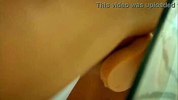 Belinda Selin enjoys a relaxing shower with a dildo close up