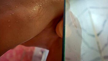 Belinda Selin enjoys a relaxing shower with a dildo close up