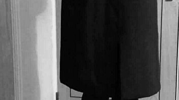 Why is the shemale crossdresser binding herself in handcuffs and uniform?