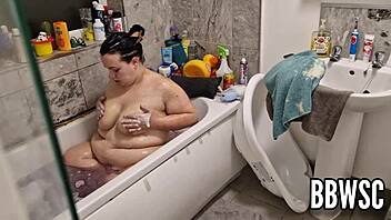 Hey, pervert spies on bbw washing giant floppy tits in bath.
