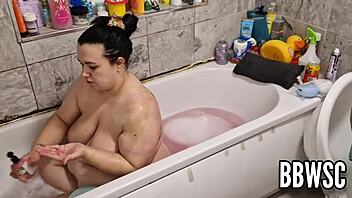 Hey, pervert spies on bbw washing giant floppy tits in bath.