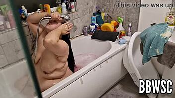 Hey, pervert spies on bbw washing giant floppy tits in bath.