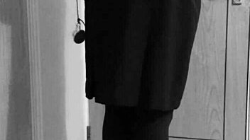 Why is the shemale crossdresser binding herself in handcuffs and uniform?