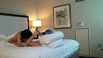 in the dimly lit room, a petite 18+ teen with tattoos eagerly sucks on a massive monster cock, deepthroating it with sloppy enthusiasm