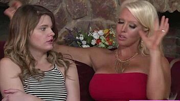 Milf Alura passionately fingers Scarlett's wet pussy while they kiss. The young blonde teen moans in pleasure.