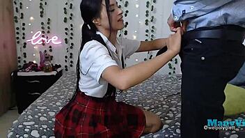 student interacts with teacher in uniform