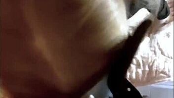 A blonde with small bosom sucks a big cock