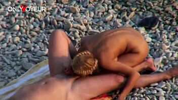 Gorgeous Blonde Babe Rides Man on Public Beach