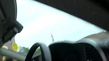 British babe with big tits eagerly masturbates in the car, ripping clothes while waiting.