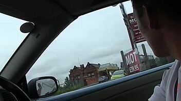 British babe with big tits eagerly masturbates in the car, ripping clothes while waiting.