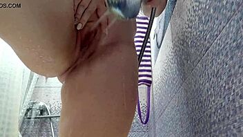 Milf plays with butt plug and dildo in shower