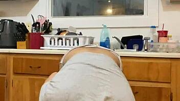 Anna Maria, a mature and sensual Latina woman, performs while washing the dishes