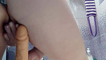 Milf plays with butt plug and dildo in shower