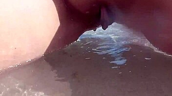my shaved pussy dripping while peeing on public beach