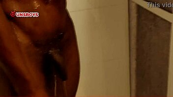 A skinny black straight guy takes a shower at his gay friend's house, leading to a homemade handjob and ass play.