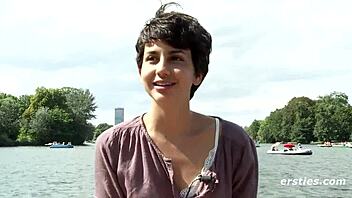 Beautiful young European woman masturbates on a boat