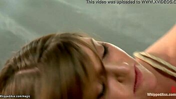 Bound lesbian endures hard spanking and deepthroat from dominant doctor