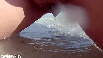my shaved pussy dripping while peeing on public beach