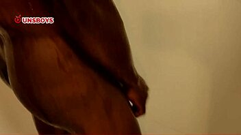 A skinny black straight guy takes a shower at his gay friend's house, leading to a homemade handjob and ass play.