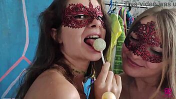 Two girls enjoy sucking on lollipops but what they like most is to suck on cocks