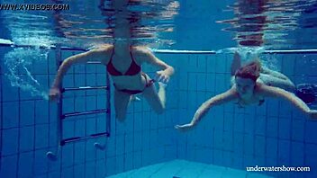 Marusia and Melisa Darkova Dive into Underwater Lesbian Fun. A Sexy Pool Adventure Awaits!