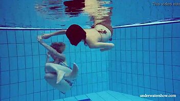 Marusia and Melisa Darkova Dive into Underwater Lesbian Fun. A Sexy Pool Adventure Awaits!