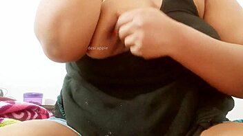 A Sri Lankan woman exposes her natural breasts