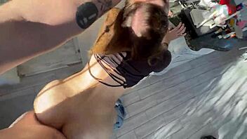 The delivery girl quenches her thirst with a sip.