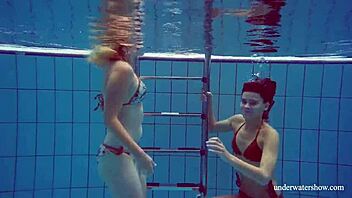 Marusia and Melisa Darkova Dive into Underwater Lesbian Fun. A Sexy Pool Adventure Awaits!