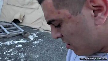 Nude military men engage in gay sex, showing penis first.