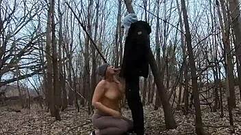 Look at her sucking cock topless in the park!