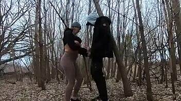 Look at her sucking cock topless in the park!