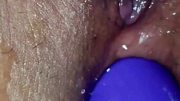 Amateur woman with big tits and boobs engages in homemade anal masturbation, fingering her ass while pleasuring her pussy