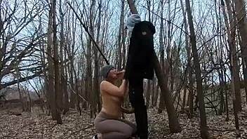 Look at her sucking cock topless in the park!