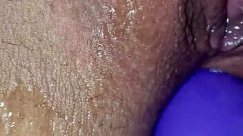 Amateur woman with big tits and boobs engages in homemade anal masturbation, fingering her ass while pleasuring her pussy