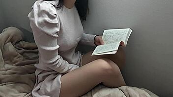 Beautiful Japanese girl reading in the morning and getting horny