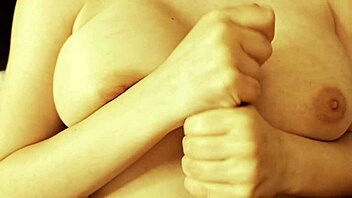 Cutie Slips Oil on Tits and Jerks Off Hard