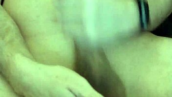 pushing in the big black plug close up