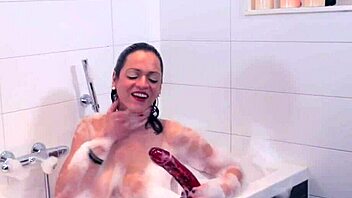 why does the shemale tug her big tits in the bath?