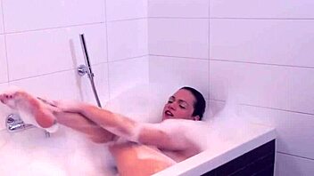 why does the shemale tug her big tits in the bath?