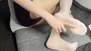 Slim gay teen 18+ indulges in foot fetish with beautiful Chinese twink