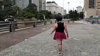 Fat crossdresser enjoys city tour with two black studs
