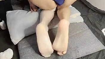Slim gay teen 18+ indulges in foot fetish with beautiful Chinese twink