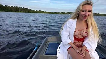 Amateur couple enjoys funny outdoor boat sex on the lake