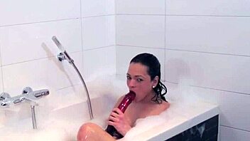 why does the shemale tug her big tits in the bath?