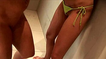 Big boobed lesbians fuck each other in a warm shower