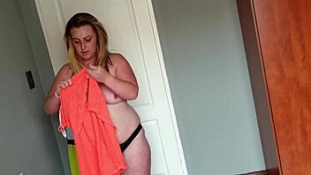 fat girl playing dress up by trying on different dresses